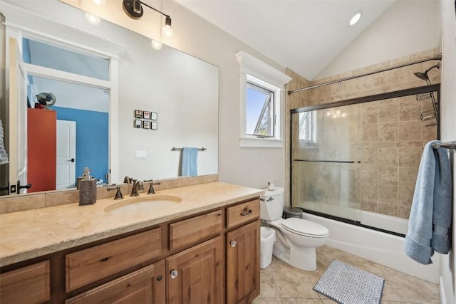bathroom featuring tile patterned flooring, vanity, combined bath / shower with glass door, toilet, and lofted ceiling