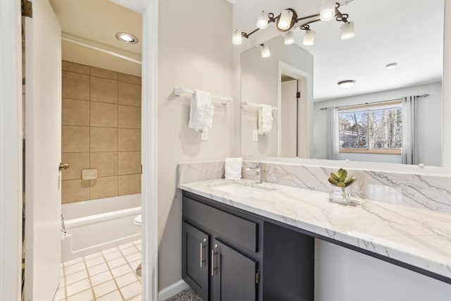 22974 US Highway 6 Unit A102, Keystone, CO 80435 - full bathroom featuring vanity, washtub / shower combination, tile patterned floors, and a chandelier