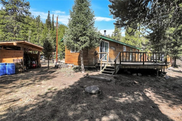 823 Gcr 8411, Tabernash, CO 80478 - view of home's exterior featuring a wooden deck and log siding