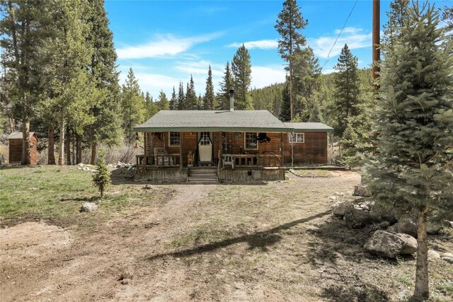 823 Gcr 8411, Tabernash, CO 80478 - rear view of property featuring covered porch and a forest view