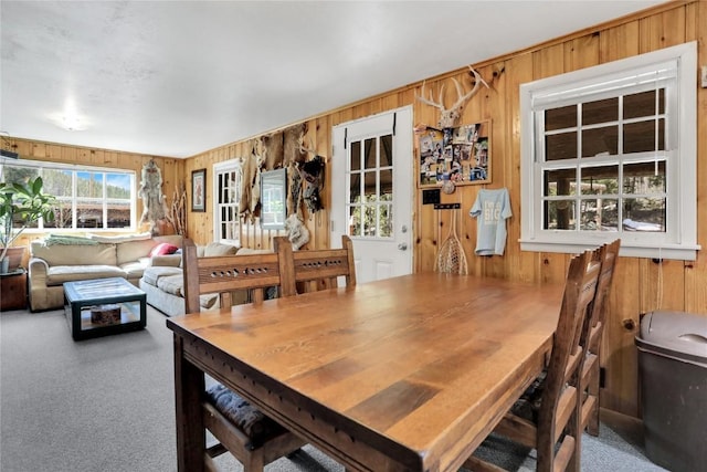 823 Gcr 8411, Tabernash, CO 80478 - dining area with wood walls and carpet flooring