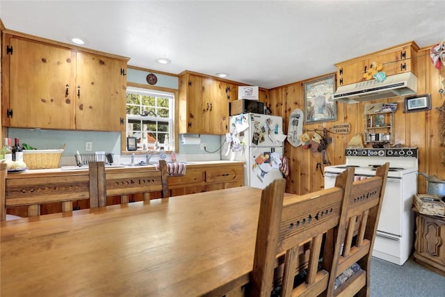 823 Gcr 8411, Tabernash, CO 80478 - kitchen with white appliances, under cabinet range hood, light countertops, recessed lighting, and wooden walls