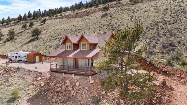 3415 Redhill Rd, Fairplay, CO 80440 - rear view of property featuring a deck and roof with shingles