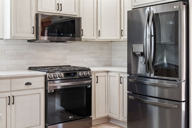 3415 Redhill Rd, Fairplay, CO 80440 - kitchen with appliances with stainless steel finishes, tasteful backsplash, and light stone countertops