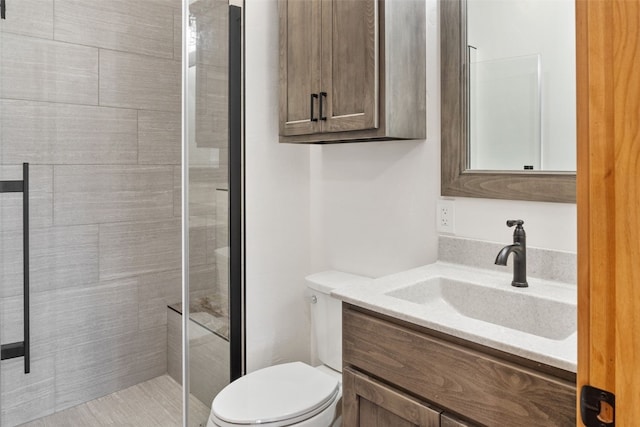 3415 Redhill Rd, Fairplay, CO 80440 - bathroom featuring toilet, vanity, and tiled shower