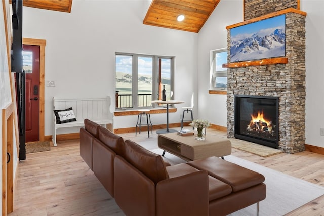 3415 Redhill Rd, Fairplay, CO 80440 - living room with light wood-style flooring, a fireplace, baseboards, and high vaulted ceiling