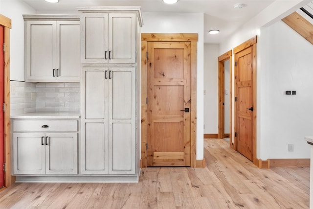 3415 Redhill Rd, Fairplay, CO 80440 - kitchen featuring light wood-type flooring, light countertops, decorative backsplash, baseboards, and recessed lighting