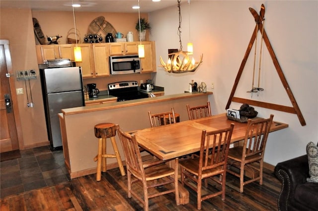 91 River Run Rd Unit 8122, Keystone, CO 80435 - dining space with a chandelier, recessed lighting, and dark wood-type flooring