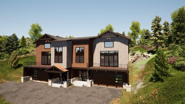 526 N Fuller Placer Rd, Breckenridge, CO 80424 - view of front facade featuring driveway, an attached garage, and a balcony