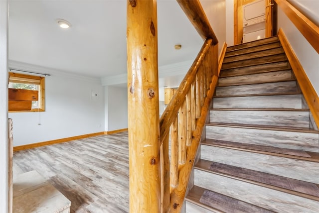 80 Cove Blvd Unit 103, Dillon, CO 80435 - staircase with wood finished floors, ornamental molding, and baseboards