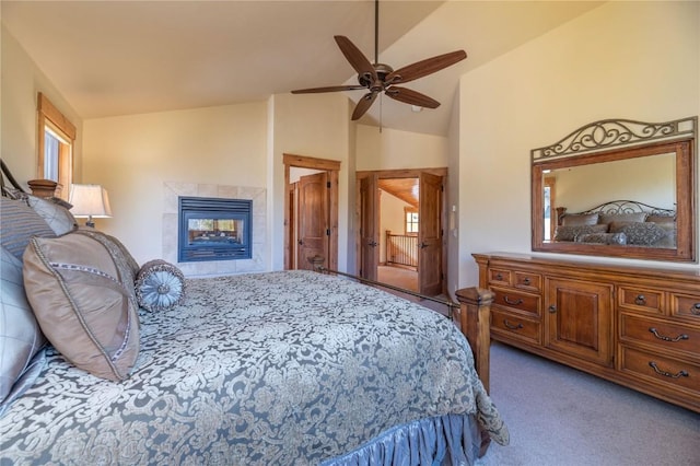 2206 Hamilton Creek Rd, Silverthorne, CO 80498 - bedroom featuring carpet floors, a tiled fireplace, ceiling fan, and high vaulted ceiling