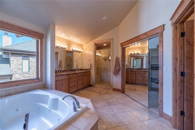 2206 Hamilton Creek Rd, Silverthorne, CO 80498 - full bathroom featuring a stall shower, vaulted ceiling, vanity, a whirlpool tub, and tile patterned flooring