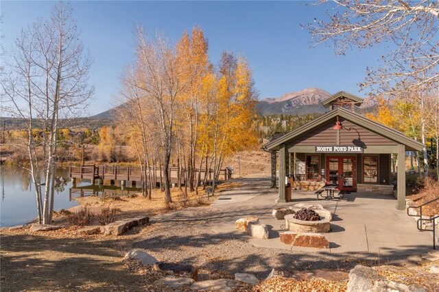 2206 Hamilton Creek Rd, Silverthorne, CO 80498 - view of property's community with a fire pit and a water and mountain view