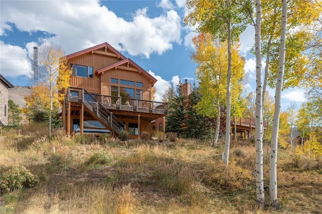 2206 Hamilton Creek Rd, Silverthorne, CO 80498 - back of house with a deck, stairway, and board and batten siding