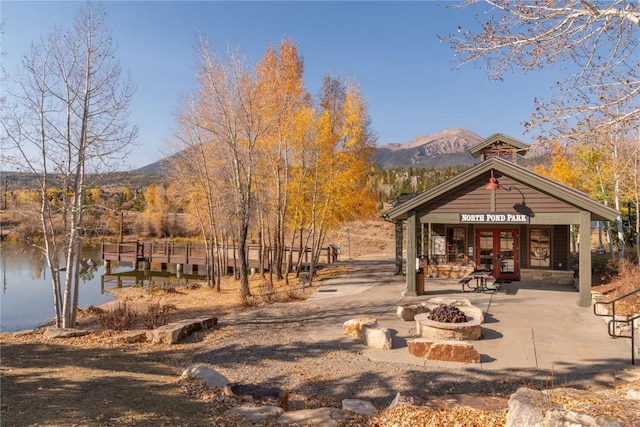 2206 Hamilton Creek Rd, Silverthorne, CO 80498 - view of property's community with a fire pit and a water and mountain view