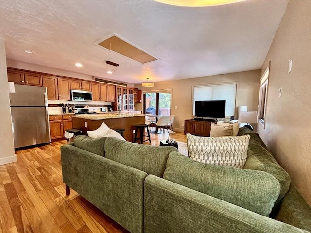 1310 Baldy Rd Unit D, Breckenridge, CO 80424 - living room featuring attic access, light wood finished floors, baseboards, and recessed lighting