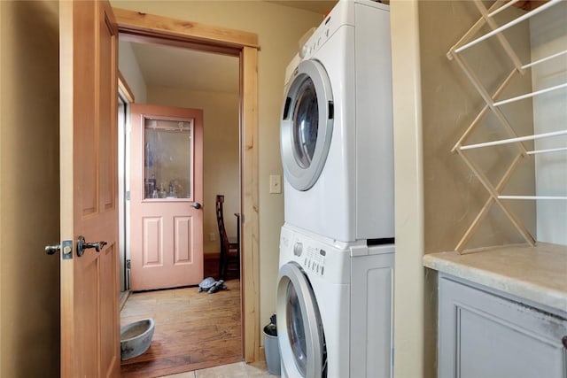 2345 Abbey Ct SW Unit 3, Steamboat Springs, CO 80487 - laundry area with stacked washer / drying machine, light wood-style flooring, and laundry area