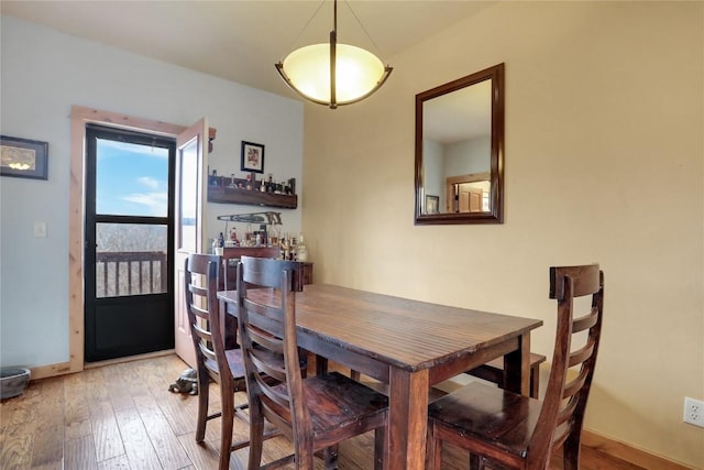 2345 Abbey Ct SW Unit 3, Steamboat Springs, CO 80487 - dining room featuring hardwood / wood-style flooring and baseboards