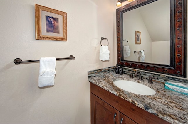 22138 US Highway 6 Unit 1560, Keystone, CO 80435 - bathroom featuring vanity and lofted ceiling
