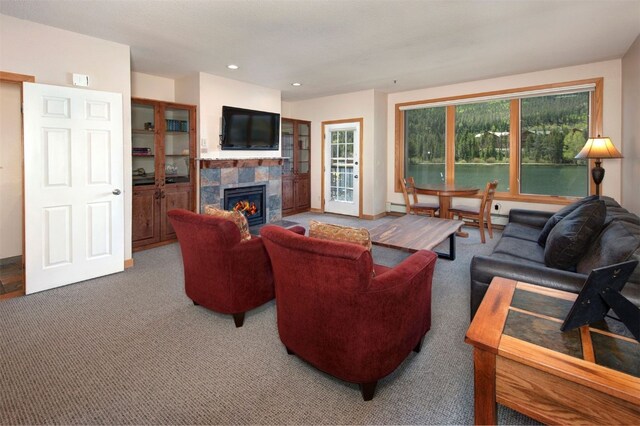 22138 US Highway 6 Unit 1560, Keystone, CO 80435 - living area with a tiled fireplace, carpet floors, a baseboard radiator, and recessed lighting