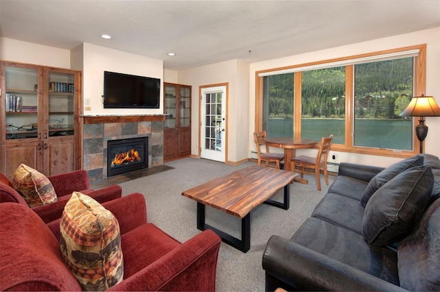 22138 US Highway 6 Unit 1560, Keystone, CO 80435 - carpeted living area with a fireplace, recessed lighting, and a baseboard heating unit