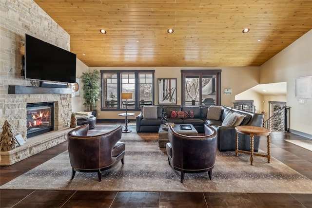 living room featuring vaulted ceiling, a stone fireplace, and wood ceiling