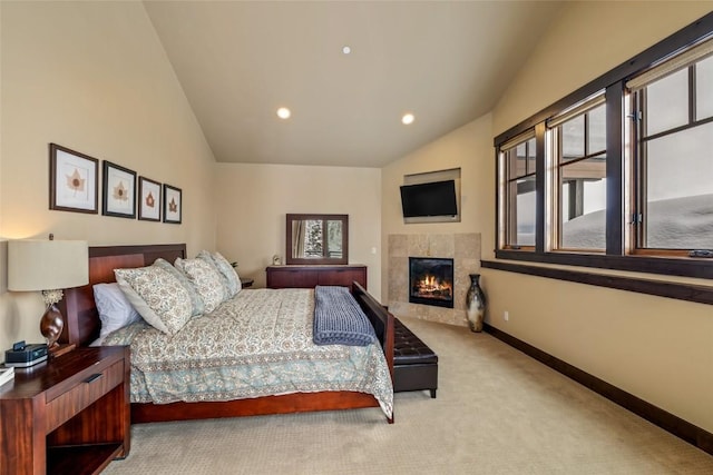 bedroom featuring a tile fireplace, recessed lighting, carpet flooring, baseboards, and vaulted ceiling