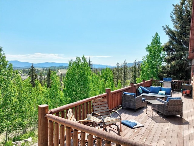 56 Apache Trl, Como, CO 80432 - wooden deck with an outdoor hangout area and a mountain view