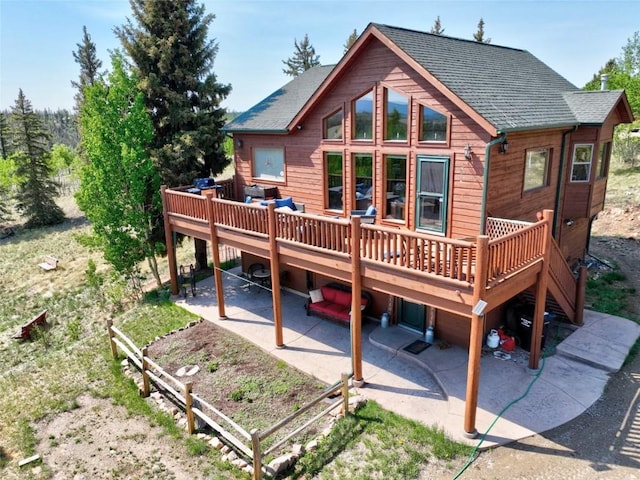 56 Apache Trl, Como, CO 80432 - back of house with a patio, a deck, and roof with shingles
