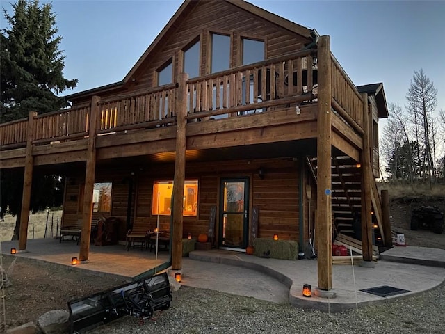 56 Apache Trl, Como, CO 80432 - back of house with a wooden deck and a patio area