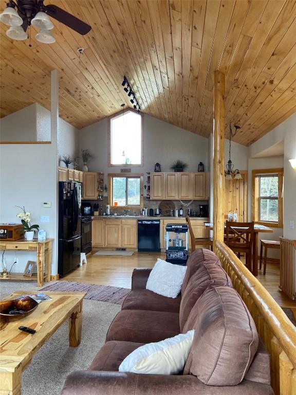 56 Apache Trl, Como, CO 80432 - living room with a ceiling fan, high vaulted ceiling, light wood finished floors, and wood ceiling