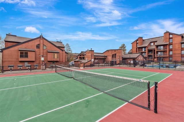 2015 Walton Creek Rd Unit 114, Steamboat Springs, CO 80487 - view of sport court featuring fence and a residential view