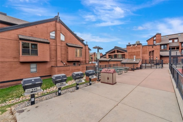 2015 Walton Creek Rd Unit 114, Steamboat Springs, CO 80487 - exterior space with a patio, fence, and a residential view