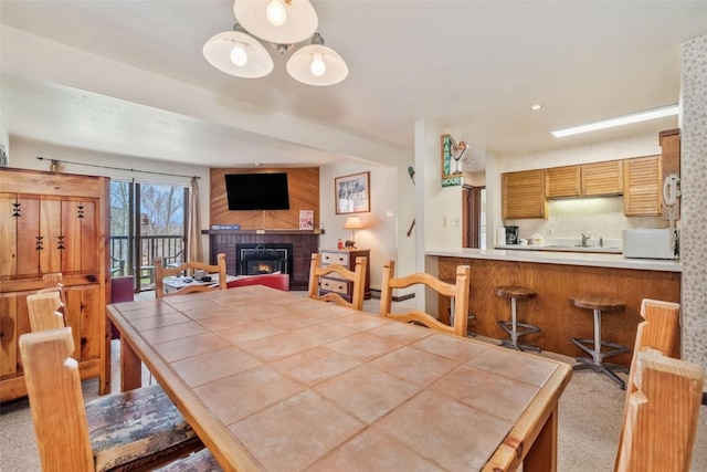 2015 Walton Creek Rd Unit 114, Steamboat Springs, CO 80487 - dining room featuring a fireplace
