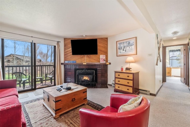 2015 Walton Creek Rd Unit 114, Steamboat Springs, CO 80487 - carpeted living room featuring baseboard heating, baseboards, and a fireplace