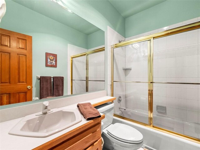 463 Blue Flag Cir, Breckenridge, CO 80424 - bathroom with toilet, vanity, and shower / bath combination with glass door
