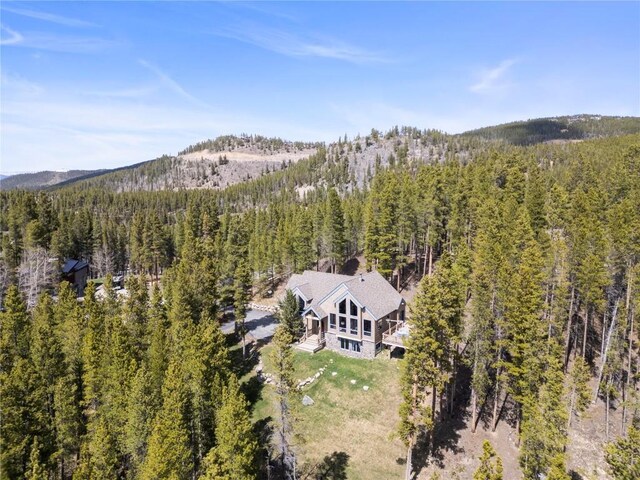 463 Blue Flag Cir, Breckenridge, CO 80424 - view of subject property with a heavily wooded area and mountains