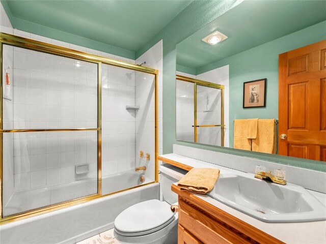463 Blue Flag Cir, Breckenridge, CO 80424 - bathroom with toilet, vanity, and combined bath / shower with glass door