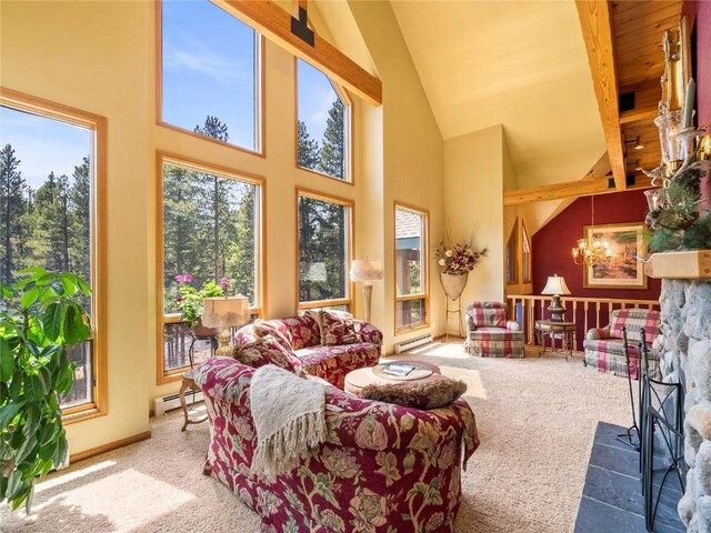 463 Blue Flag Cir, Breckenridge, CO 80424 - carpeted living room featuring a baseboard radiator, high vaulted ceiling, and a chandelier