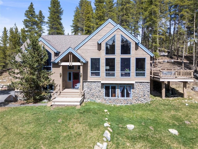 463 Blue Flag Cir, Breckenridge, CO 80424 - view of front of home with stone siding, a front yard, and a deck