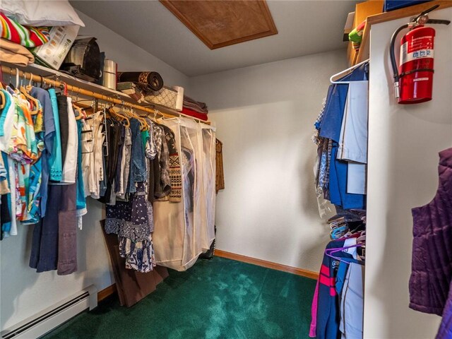 463 Blue Flag Cir, Breckenridge, CO 80424 - spacious closet featuring a baseboard radiator, carpet, and attic access