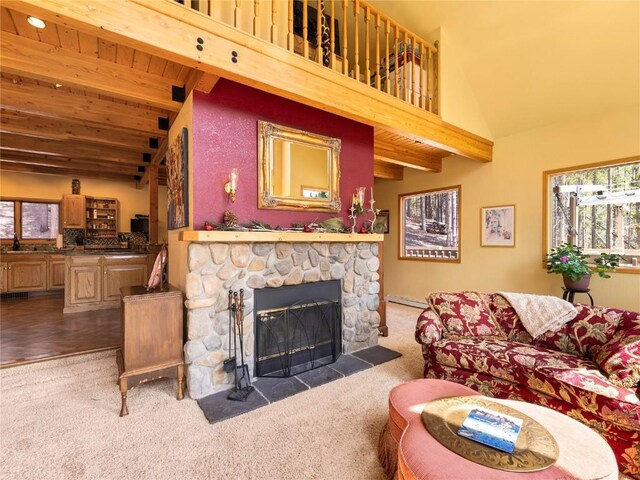 463 Blue Flag Cir, Breckenridge, CO 80424 - carpeted living area with a fireplace, baseboard heating, high vaulted ceiling, and wooden ceiling with exposed beams