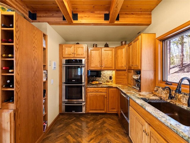 463 Blue Flag Cir, Breckenridge, CO 80424 - kitchen featuring stainless steel appliances, a sink, light stone countertops, wooden ceiling with exposed beams, and decorative backsplash