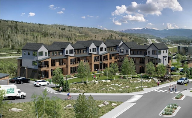 birds eye view of property featuring a mountain view