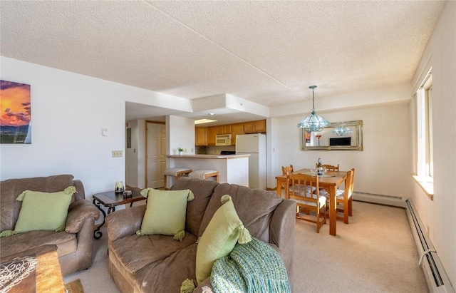 living room with a textured ceiling, electric panel, baseboard heating, and light colored carpet