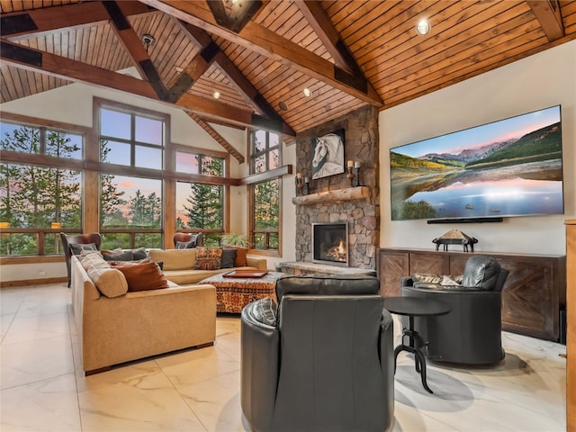59 Mountain Bluebell Rd, Keystone, CO 80435 - living room with wooden ceiling with exposed beams, a fireplace, plenty of natural light, light marble finish flooring, and high vaulted ceiling