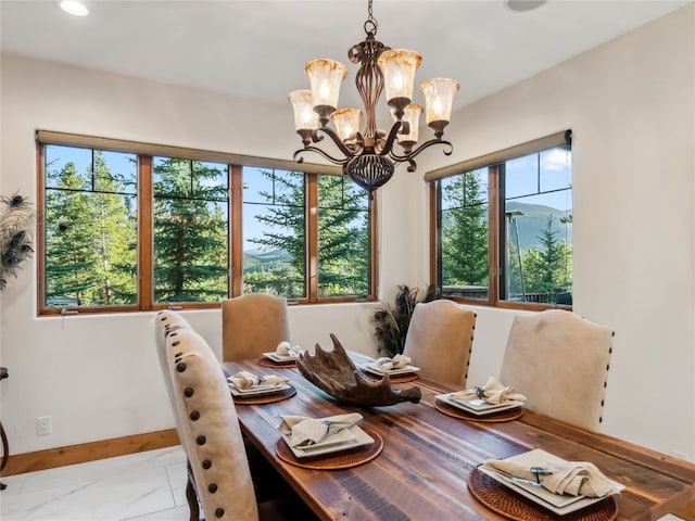 59 Mountain Bluebell Rd, Keystone, CO 80435 - dining room with plenty of natural light, marble finish floors, a chandelier, baseboards, and recessed lighting