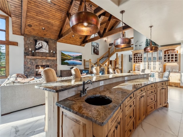 59 Mountain Bluebell Rd, Keystone, CO 80435 - kitchen with a sink, open floor plan, wood ceiling with exposed beams, plenty of natural light, and high vaulted ceiling