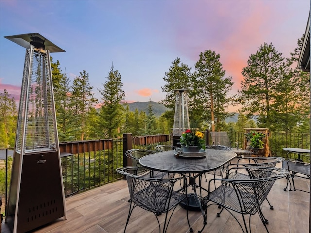 59 Mountain Bluebell Rd, Keystone, CO 80435 - wooden terrace with outdoor dining area and a mountain view