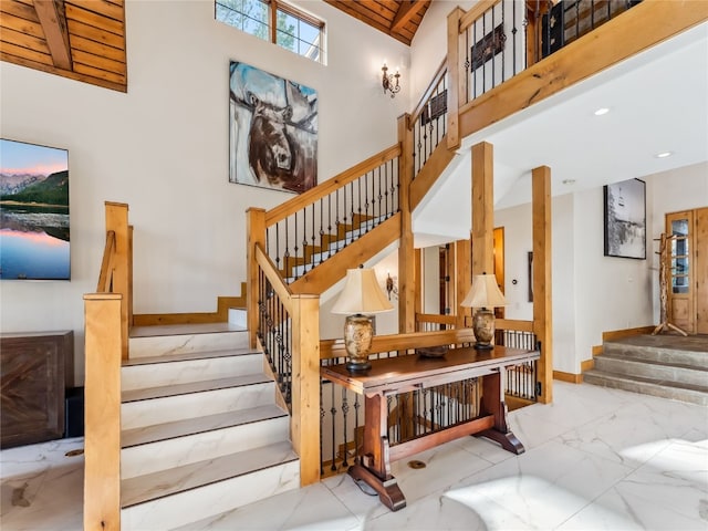 59 Mountain Bluebell Rd, Keystone, CO 80435 - staircase featuring marble tiled floors, high vaulted ceiling, wooden ceiling, and recessed lighting